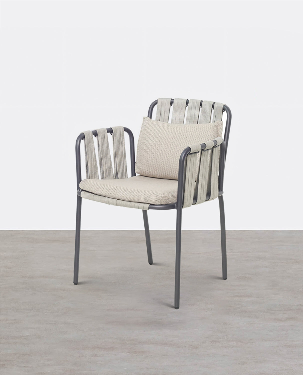 Chair with beige cushion and metal frame on a light wooden floor | Extraordinary Emporium 
