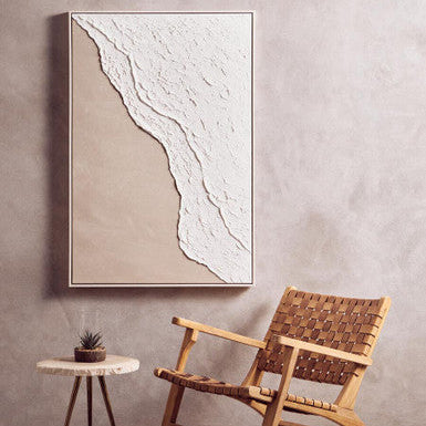 Abstract wall art piece on a gray wall with a wicker chair and small table below. | Extraordinary Emporium 